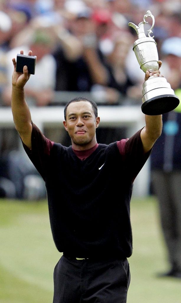 Tiger Woods celebrates winning the 134th Open Championship in 2005