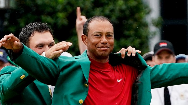 Tiger Woods dons the Green Jacket for a fifth time