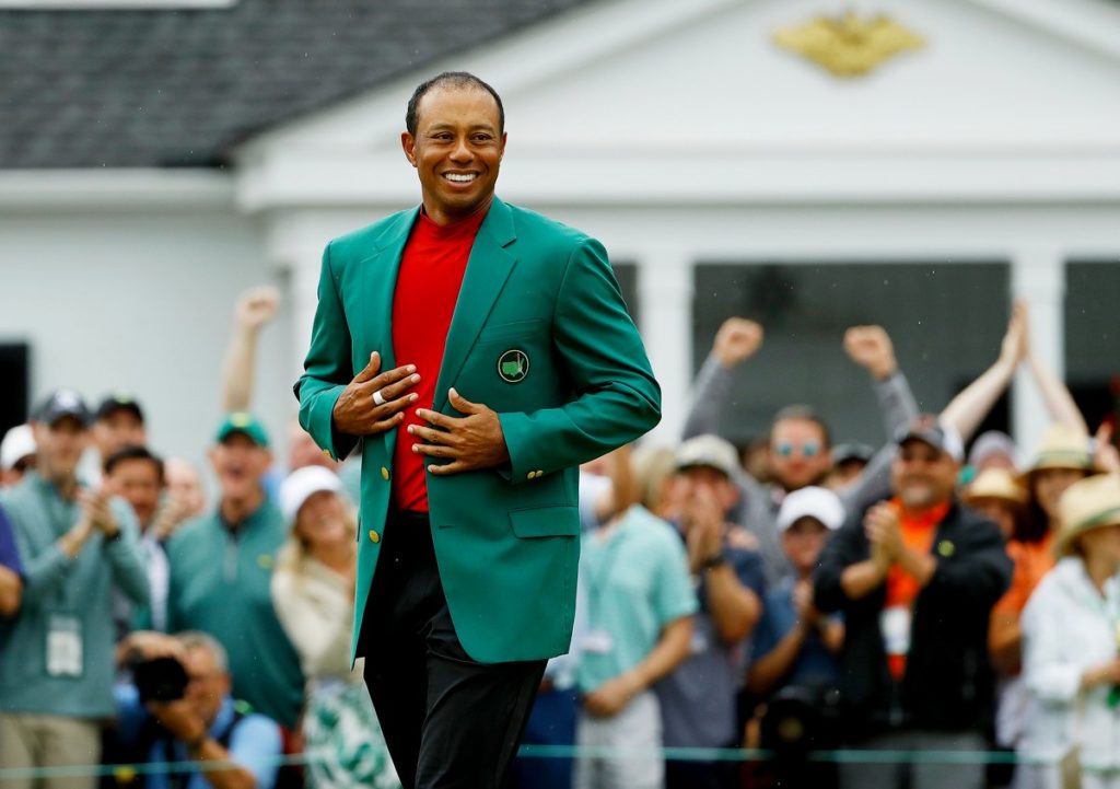 Masters champion Tiger Woods celebrates in the green jacket