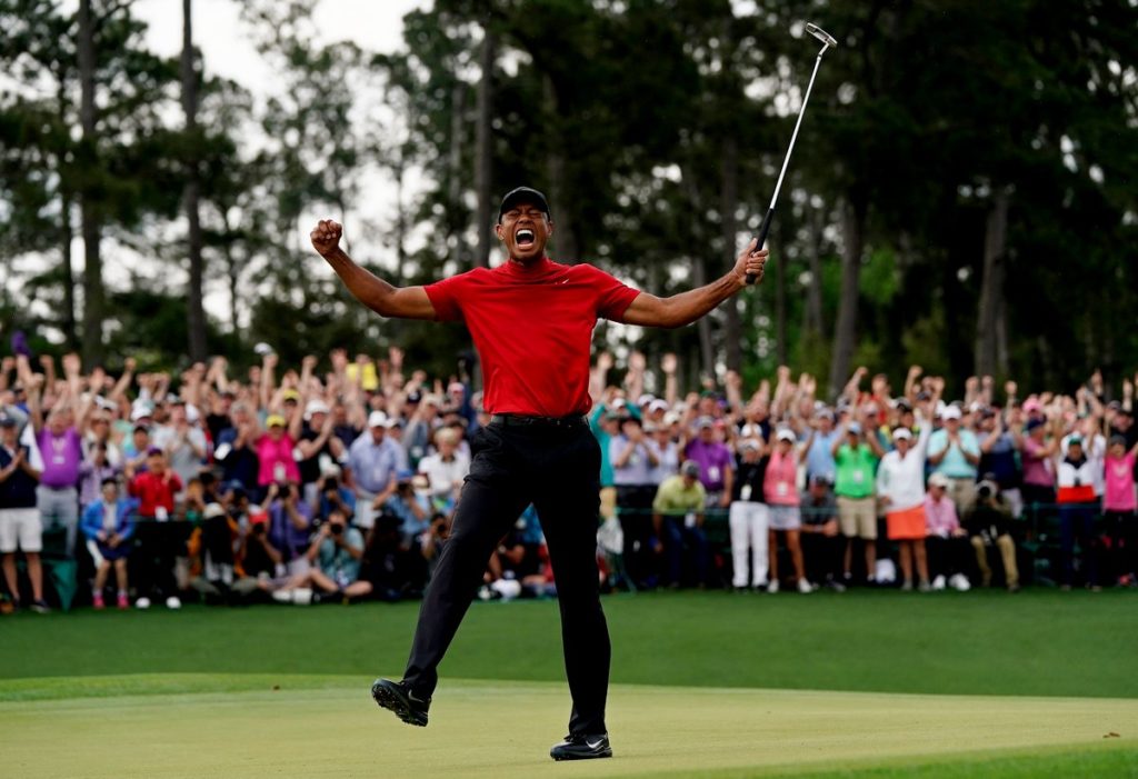 Tiger Woods celebrates winning his 15th major title
