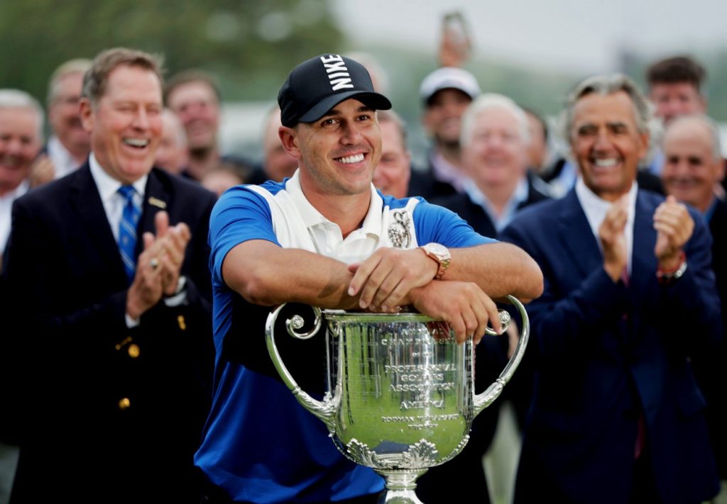 Brooks Koepka poses with the Wanamaker Trophy after winning the US PGA Championship (AP Photo/Julio Cortez) Can he become one of golf's all-time greats?