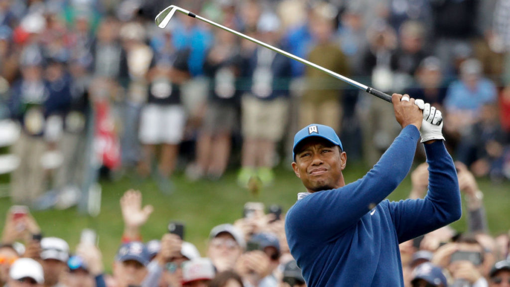 Tiger Woods watches his tee shot on the fourth hole during the second round of the U.S. Open golf tournament. (AP Photo/Marcio Jose Sanchez)