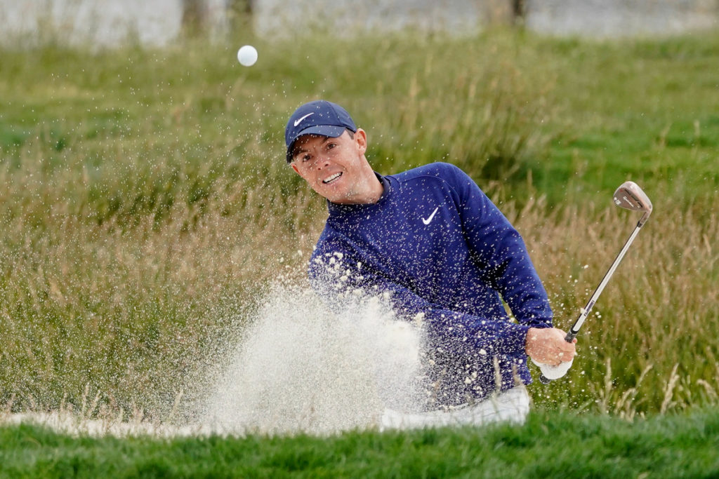 Rory McIlroy, of Northern Ireland, hits out of a bunker on the 17th hole during the third round of the U.S. Open golf tournament Saturday, June 15, 2019, in Pebble Beach, Calif. (David J Phillip/AP)