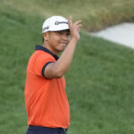 Arnold Palmer 2023 R3 - Kurt Kitayama waves to the gallery after sinking a birdie putt on the 18th hole during third round of the Arnold Palmer Invitational golf tournament