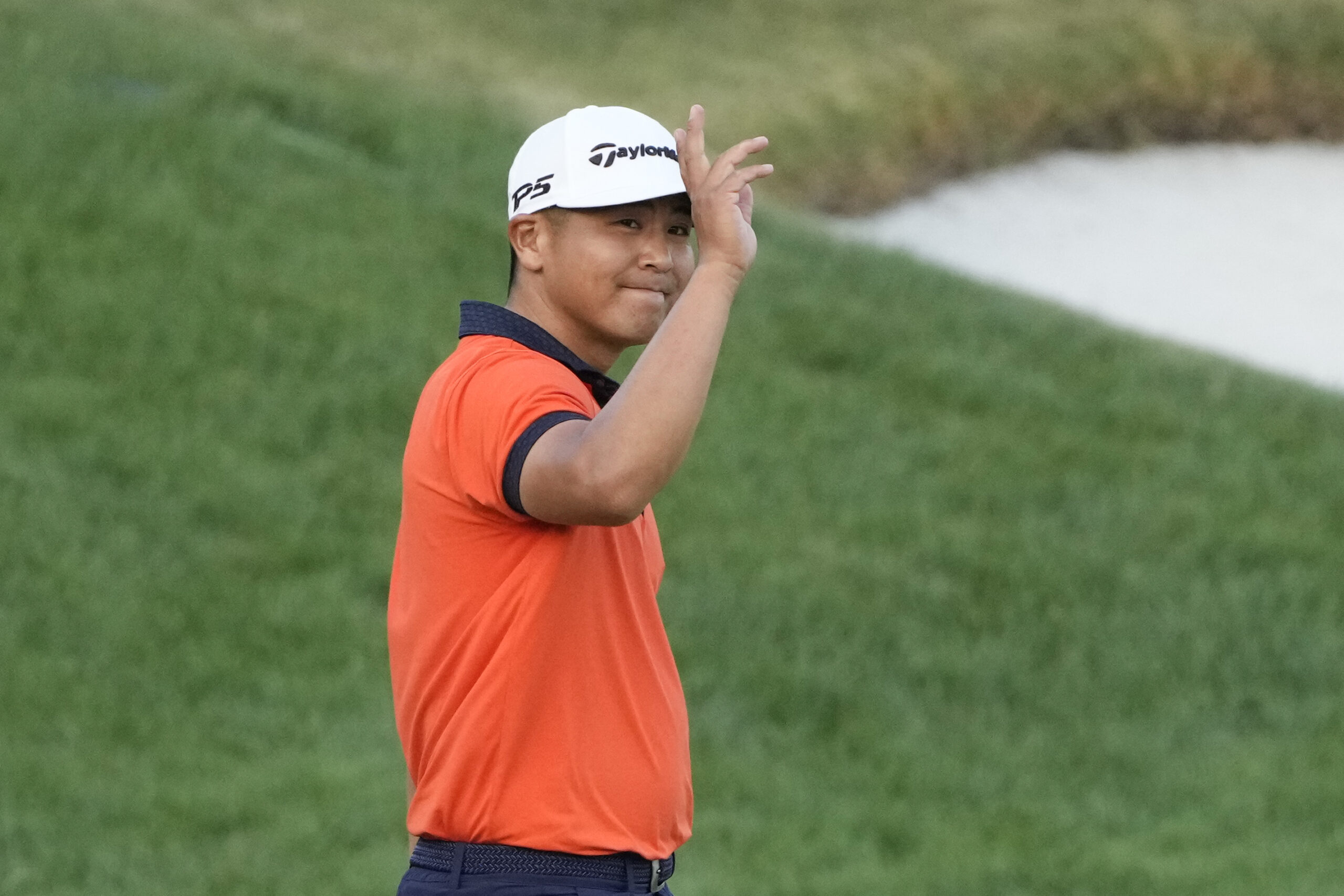 Arnold Palmer 2023 R3 - Kurt Kitayama waves to the gallery after sinking a birdie putt on the 18th hole during third round of the Arnold Palmer Invitational golf tournament