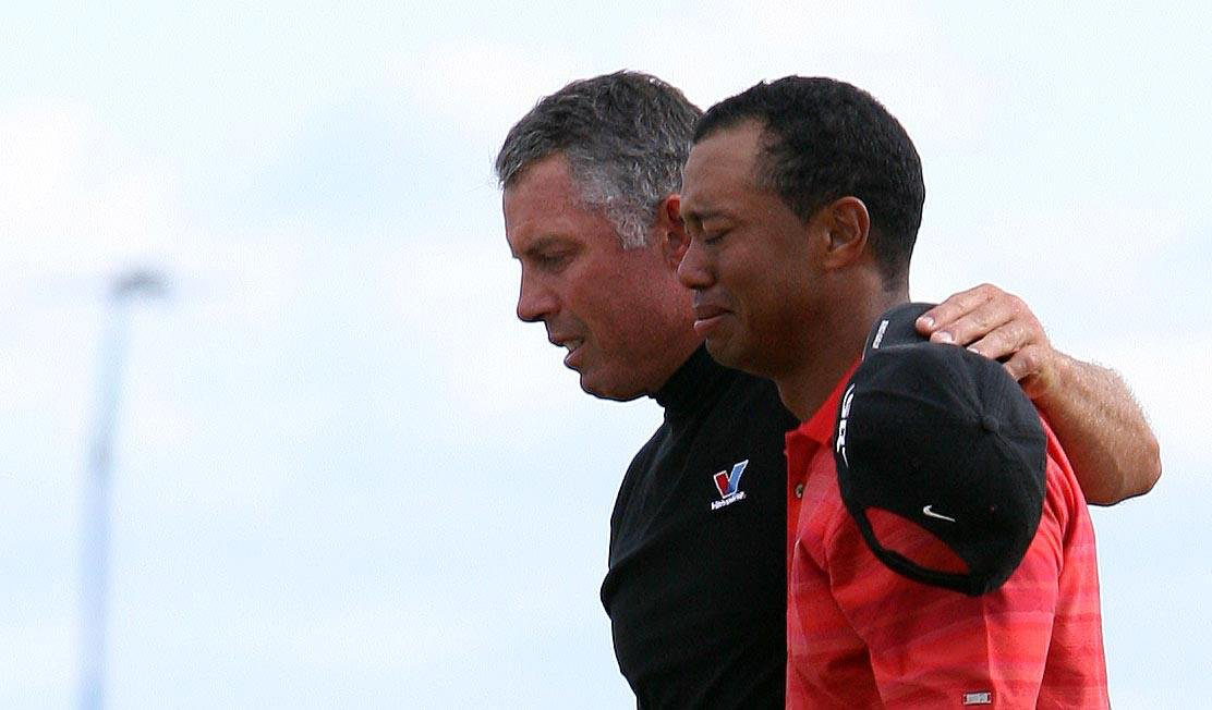 Tiger Woods (right) cries after sinking the final putt to win the 2006 Open at Hoylake