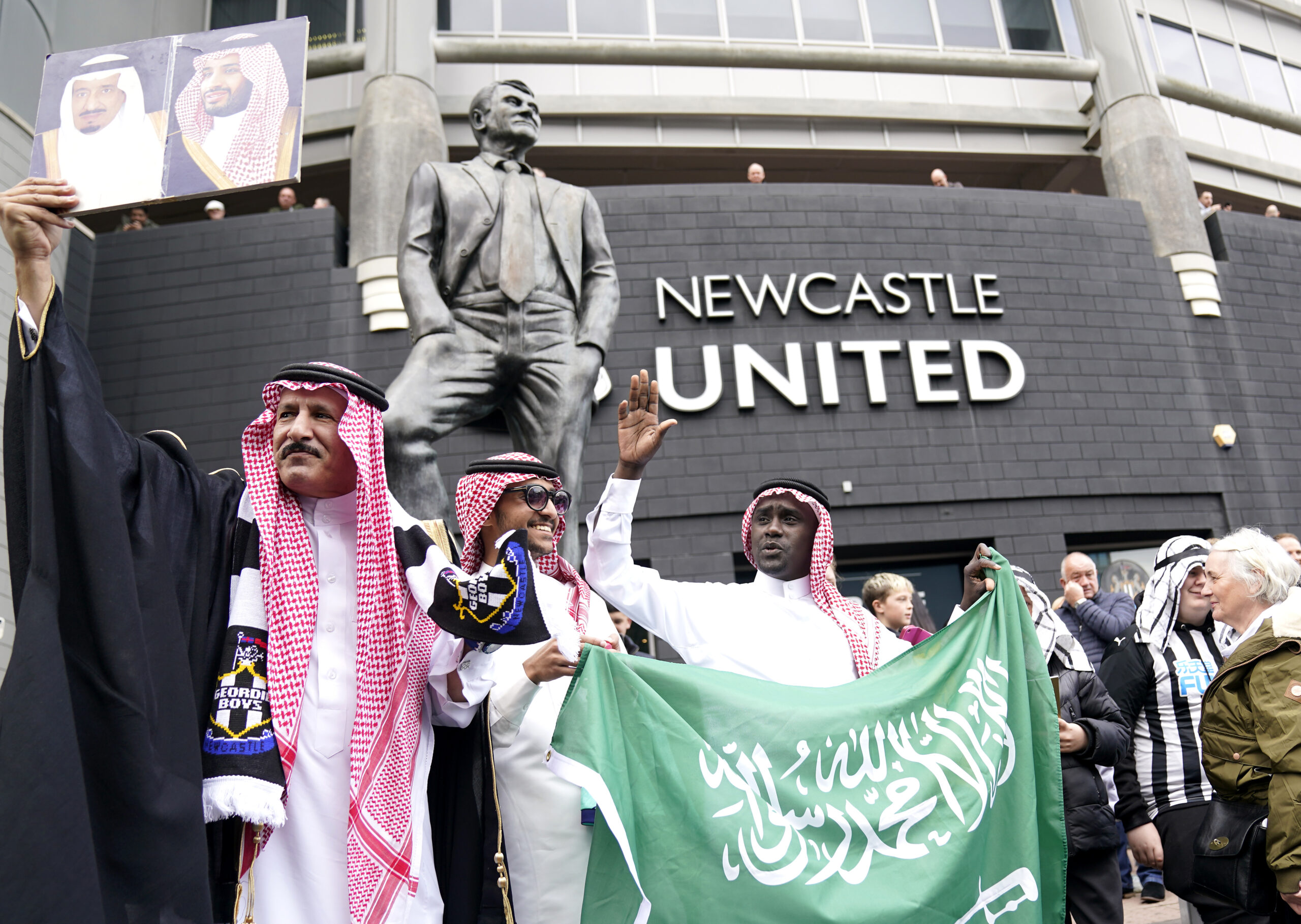 Fans celebrate the Saudi takeover of Newcastle