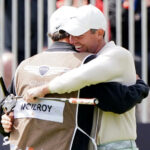 Rory McIlroy celebrates with caddie Harry Diamond after winning the Genesis Scottish Open