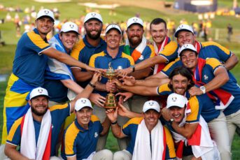 Captain Luke Donald and his players hold the Ryder Cup