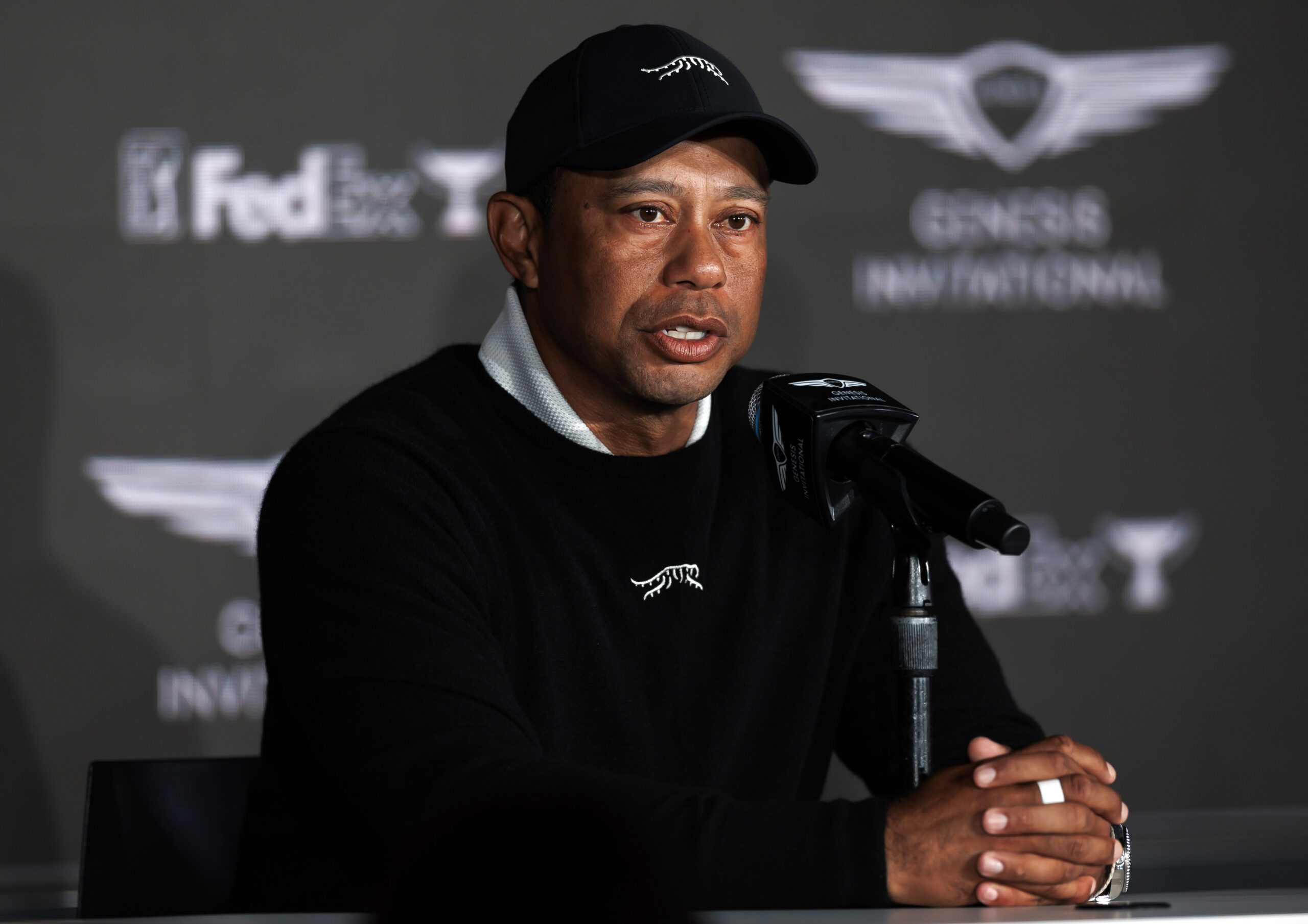 Tiger Woods speaks at a news conference