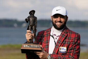 Scottie Scheffler holds the trophy after winning the RBC Heritage for his fourth win in five starts