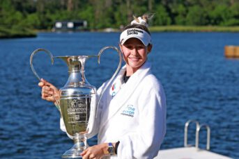 Nelly Korda celebrates with the trophy after winning The Chevron Championship