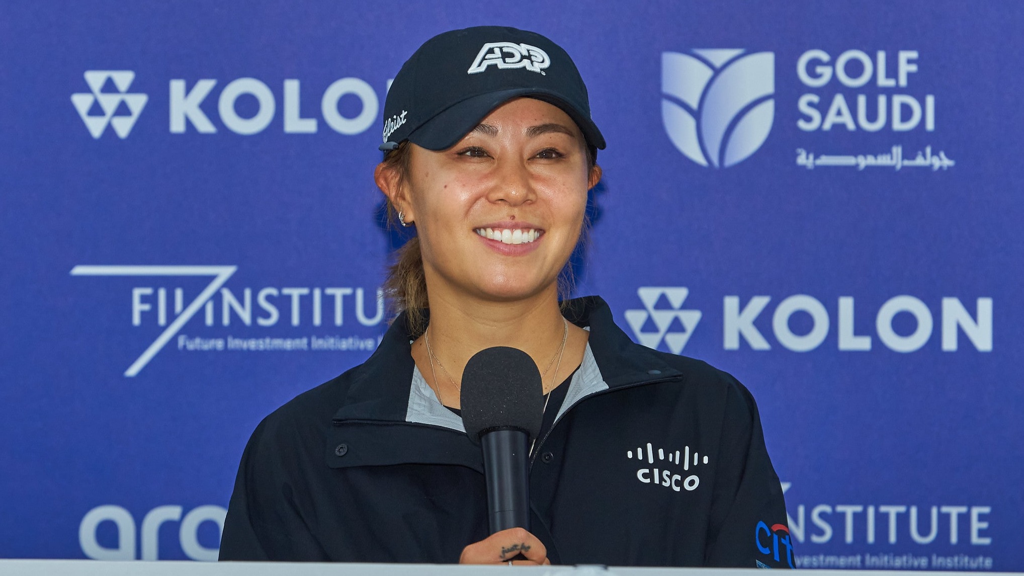 Danielle Kang at speaking at the press conference
