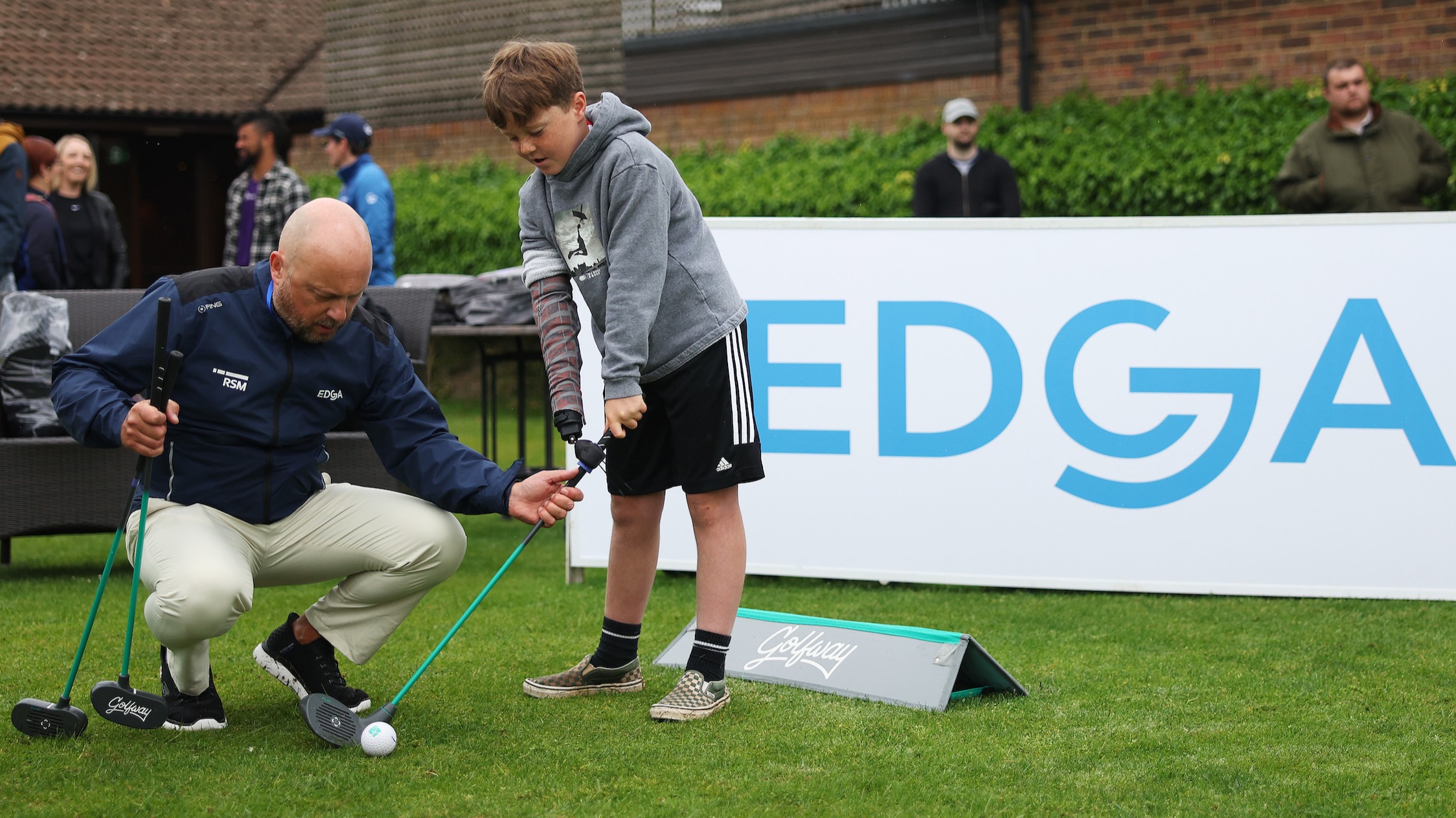 Freddie gets a lesson at Woburn Golf Club with his Koalaa prosthetic 
