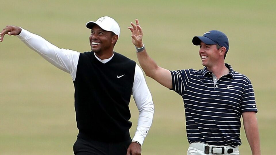 Tiger Woods (left) and Rory McIlroy of Team Woods on the 18th fairway during the R&A Celebration of Champions event at the Old Course, St Andrews. Picture date: Monday July 11, 2022.