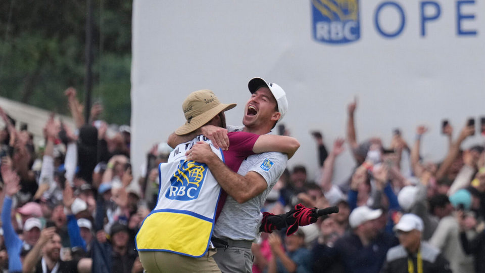 Nick Taylor, second from left, of Canada, reacts after winning the Canadian Open golf tournament on the fourth playoff hole
