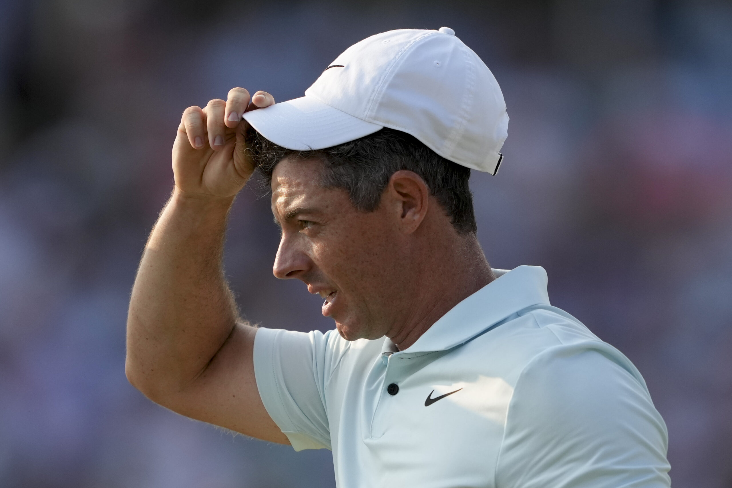 Rory McIlroy takes off his cap