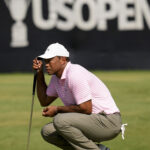 Tiger Woods reads a putt during the opening round of the US Open at Pinehurst