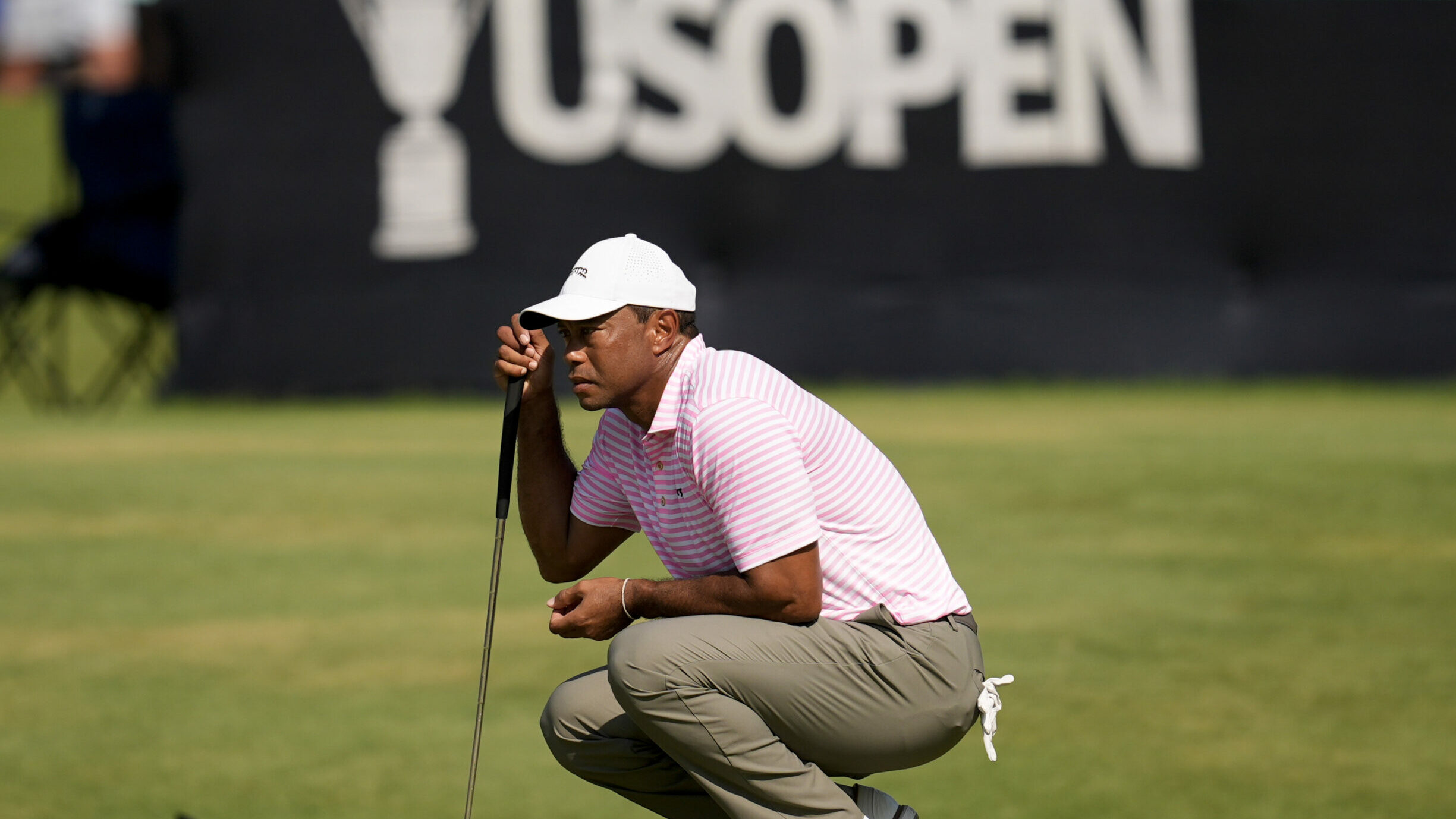 Tiger Woods reads a putt during the opening round of the US Open at Pinehurst