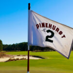 A detailed view of the hole 18 flag on Course No. 2 - Pinehurst No. 2 is set to host the 2024 US Open
