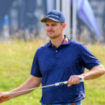 Justin Rose wipes his putter face during the Genesis Scottish Open.