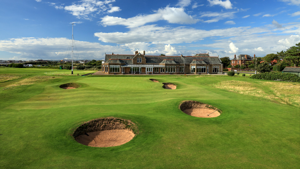 A general view of the par 4, eighteenth hole and clubhouse at Royal Troon