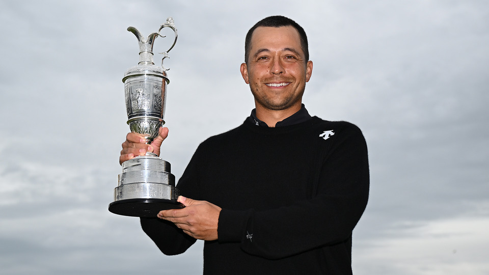 Xander Schauffele of the United States lifts the Claret Jug on the 18th green in celebration of victory on day four of The 152nd Open championship at Royal Troon on July 21, 2024