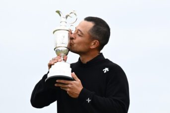Xander Schauffele of the United States kisses the Claret Jug on the 18th green in celebration of victory on day four of The 152nd Open championship at Royal Troon on July 21, 2024
