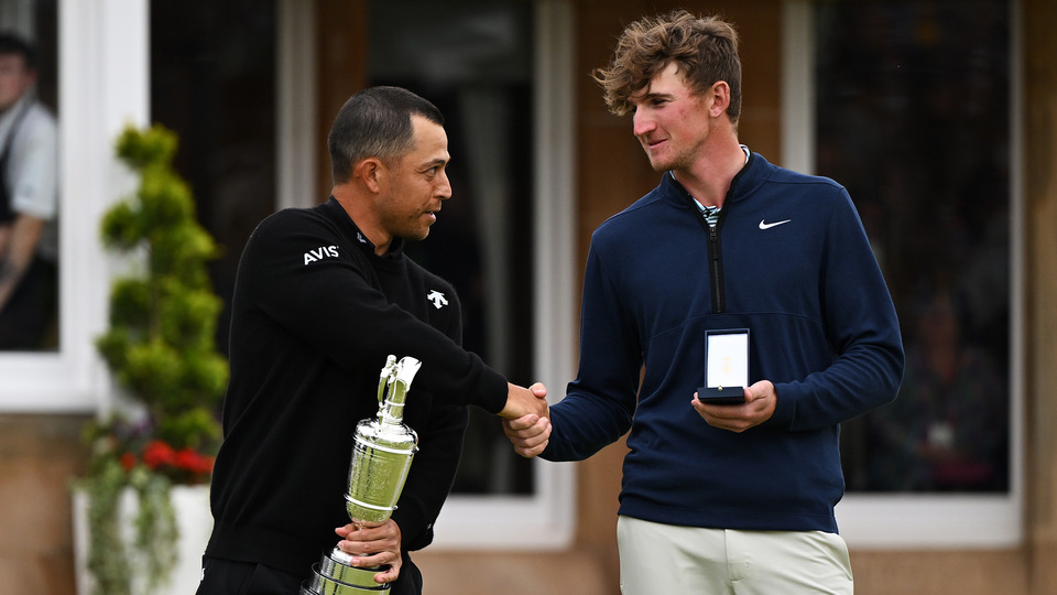 Champion, Xander Schauffele of the United States shakes hands with Leading Amateur, Calum Scott of Scotland 