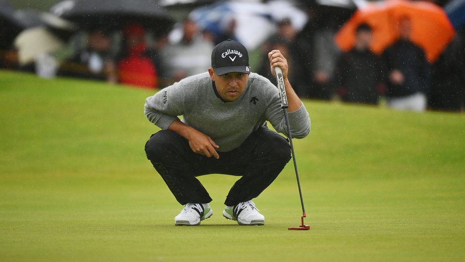 Xander Schauffele of the United States lines up a putt on the 14th green on day three of The 152nd Open championship