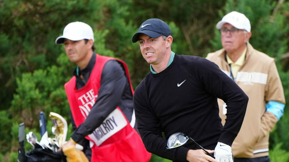 Rory McIlroy watches his tee shot on the 12th