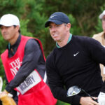 Rory McIlroy watches his tee shot on the 12th