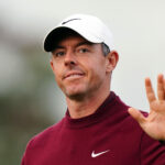 A disappointed Rory McIlroy waves to the crowd