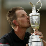 Henrik Stenson kisses the Claret Jug