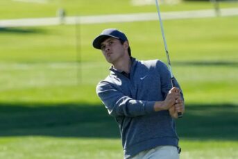 Davis Thompson watches his shot on the 11th hole during the 2023 American Express