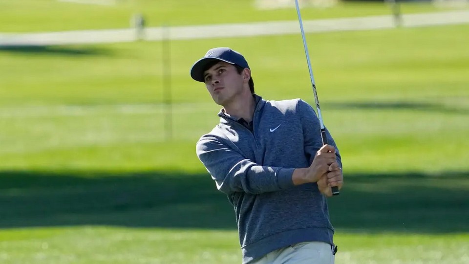 Davis Thompson watches his shot on the 11th hole during the 2023 American Express