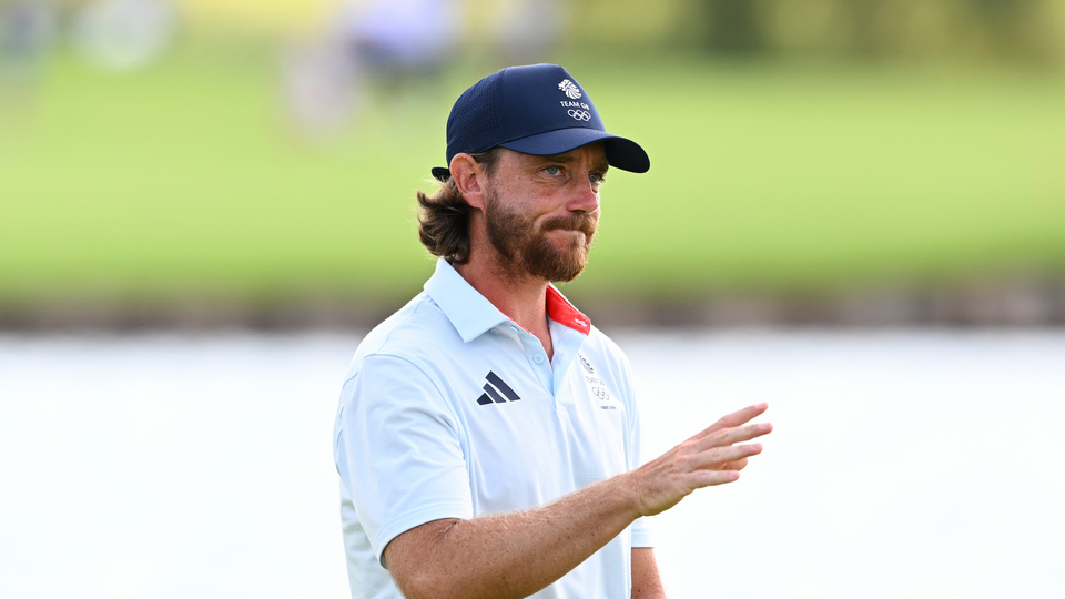 Tommy Fleetwood of Team Great Britain waves at the 18th green during the second round of the 2024 Paris Olympics at Le Golf National