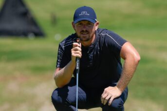 Matt Wallace studies his putt at the 9th green during the second round of the Mexico Open golf tournament in Puerto Vallarta